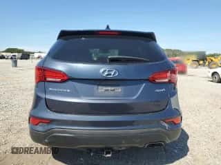 2017 Hyundai Santa Fe 2.4L z VIN 5XYZU3LB6HG387721, wystawiony jako Copart lot #81710025 z przebiegiem 105 632 mil mil oraz Szkoda całkowita • Salvage title. Historia ofert i sprzedaży dostępna na DreamBid. Obrazek 6.