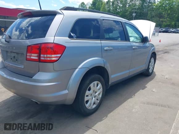 2019 Dodge Journey SE Value with VIN 3C4PDCAB7KT870550, listed as a IAAI auction lot 42327883 with 128,002 mi miles and . Bid and sale history available at DreamBid. Image 4.