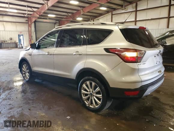 2017 Ford Escape Titanium with VIN 1FMCU9JD1HUA79587, listed as a Copart auction lot 84209285 with 61,058 mi miles and Clean title. Bid and sale history available at DreamBid. Image 2.