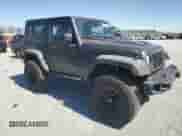 2014 Jeep Wrangler Rubicon with VIN 1C4BJWCG7EL256627, listed as a Copart auction lot 49608025 with 149,428 mi miles and Salvage title. Bid and sale history available at DreamBid. Image 4.