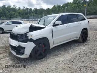 2014 Jeep Grand Cherokee SRT-8 z VIN 1C4RJFDJ2EC242210, wystawiony jako Copart lot #60677855 z przebiegiem 68 050 mil mil oraz Szkoda całkowita • Salvage title. Historia ofert i sprzedaży dostępna na DreamBid. Obrazek 1.