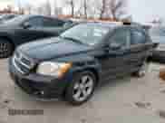 2010 Dodge Caliber Mainstreet with VIN 1B3CB3HAXAD551716, listed as a Copart auction lot 77349503 with 144,209 mi miles and Salvage title. Bid and sale history available at DreamBid. Image 1.