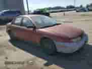 1997 Saturn SL with VIN 1G8ZF5285VZ412630, listed as a Copart auction lot 74937694 with 165,371 mi miles and Salvage title. Bid and sale history available at DreamBid. Image 4.