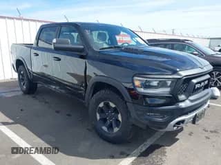 2019 Ram 1500 Rebel z VIN 1C6SRFLT2KN592652, wystawiony jako IAAI lot #41989054 z przebiegiem 71 630 mil mil oraz . Historia ofert i sprzedaży dostępna na DreamBid. Obrazek 1.