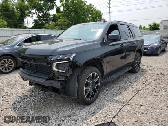 2023 Chevrolet Tahoe RST с VIN 1GNSKRKD5PR299764, выставлен на аукционе Copart как лот 58205815 с пробегом 19 550 миль миль и Списание • Salvage title. История ставок и продаж доступна на DreamBid. Изображение 1.