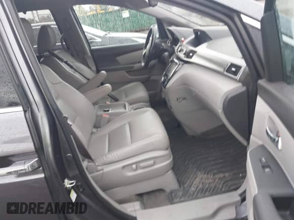 2016 Honda Odyssey Touring Elite z VIN 5FNRL5H92GB052661, wystawiony jako IAAI lot #43451962 z przebiegiem 145 569 mil mil oraz . Historia ofert i sprzedaży dostępna na DreamBid. Obrazek 5.