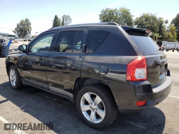 2011 Jeep Compass with VIN 1J4NT1FA0BD137755, listed as a Copart auction lot 69515235 with 108,023 mi miles and Salvage title. Bid and sale history available at DreamBid. Image 2.