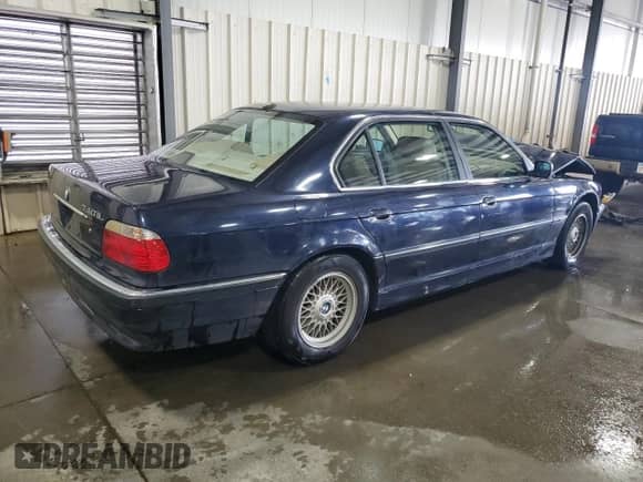 2001 BMW 7 Series 740iL with VIN WBAGH834X1DP22703, listed as a Copart auction lot 70205585 with 121,569 mi miles and Salvage title. Bid and sale history available at DreamBid. Image 3.