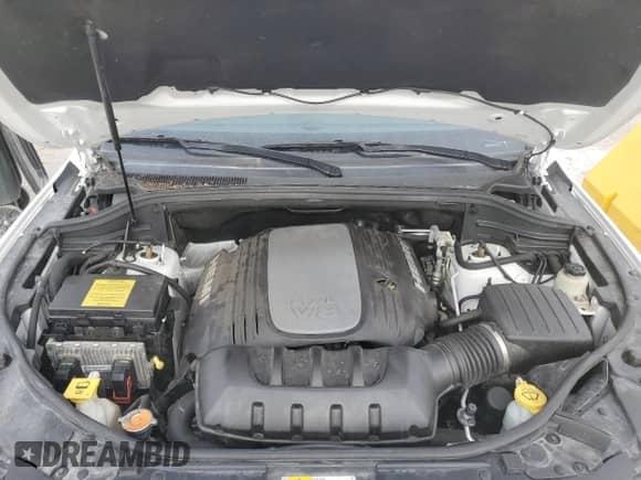 2014 Jeep Grand Cherokee Summit with VIN 1C4RJFJT3EC279918, listed as a Copart auction lot 60592045 with 108,598 mi miles and Salvage title. Bid and sale history available at DreamBid. Image 12.