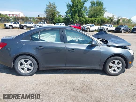 2013 Chevrolet Cruze 1LT with VIN 1G1PC5SB6D7200341, listed as a IAAI auction lot 43001982 with Not provided miles and . Bid and sale history available at DreamBid. Image 13.