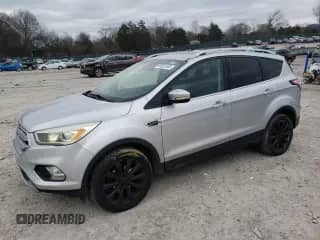 2017 Ford Escape Titanium with VIN 1FMCU0JD9HUD04723, listed as a Copart auction lot 87801365 with 126,452 mi miles and Salvage title. Bid and sale history available at DreamBid. Image 1.