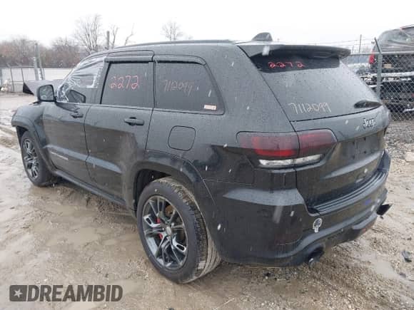 2015 Jeep Grand Cherokee SRT z VIN 1C4RJFDJ4FC613076, wystawiony jako IAAI lot #41732272 z przebiegiem 152 538 mil mil oraz . Historia ofert i sprzedaży dostępna na DreamBid. Obrazek 3.