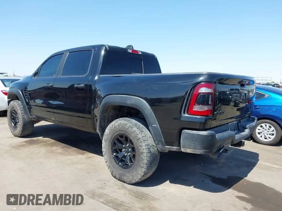 2022 Ram 1500 TRX with VIN 1C6SRFU99NN215579, listed as a IAAI auction lot 42475901 with 37,736 mi miles and . Bid and sale history available at DreamBid. Image 3.
