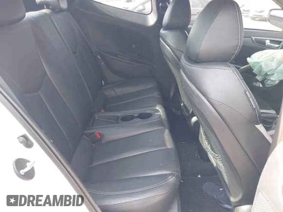 2013 Hyundai Veloster Turbo с VIN KMHTC6AE6DU097460, выставлен на аукционе IAAI как лот 42099379 с пробегом 82 240 миль миль и . История ставок и продаж доступна на DreamBid. Изображение 8.