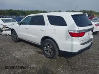 2013 Dodge Durango SXT with VIN 1C4RDHAG0DC693064, listed as a IAAI auction lot 43300866 with 244,392 mi miles and . Bid and sale history available at DreamBid. Image 3.