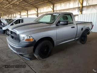2012 Ram 1500 ST with VIN 3C6JD6AKXCG179330, listed as a Copart auction lot 63710844 with 142,010 mi miles and Salvage title. Bid and sale history available at DreamBid. Image 1.