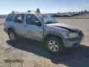 1999 Nissan Pathfinder XE with VIN JN8AR07Y1XW351047, listed as a Copart auction lot 66862195 with 197,322 mi miles and Salvage title. Bid and sale history available at DreamBid. Image 4.