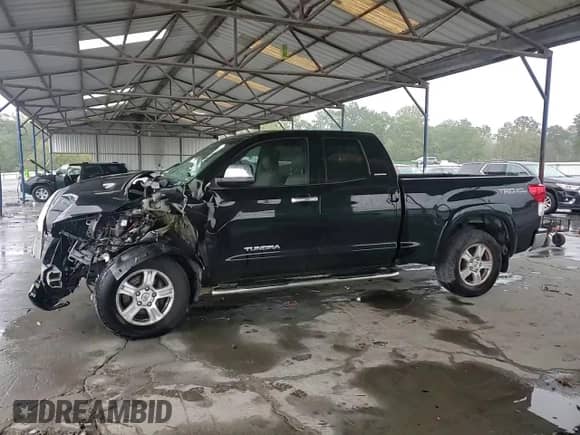 2012 Toyota Tundra Limited z VIN 5TFSY5F16CX118662, wystawiony jako Copart lot #73175064 z przebiegiem Nie podano mil oraz Szkoda całkowita • Salvage title. Historia ofert i sprzedaży dostępna na DreamBid. Obrazek 11.