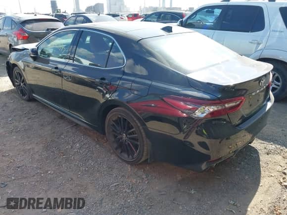 2023 Toyota Camry XSE with VIN 4T1K61AK3PU100136, listed as a IAAI auction lot 43222647 with 77,489 mi miles and . Bid and sale history available at DreamBid. Image 3.