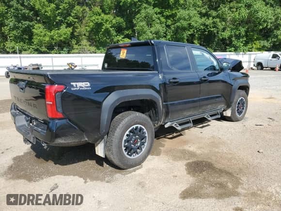 2024 Toyota Tacoma SR5 with VIN 3TMLB5JN2RM041030, listed as a Copart auction lot 65791715 with 7,311 mi miles and Salvage title. Bid and sale history available at DreamBid. Image 3.