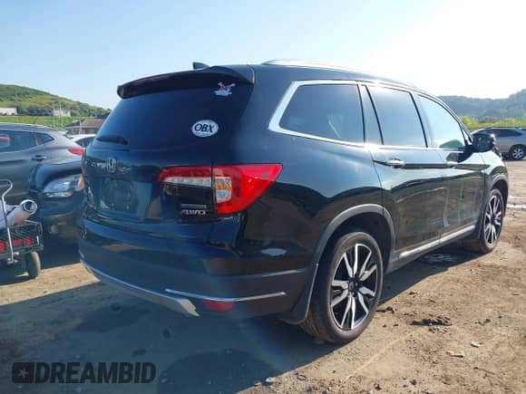 2019 Honda Pilot Touring 8-Passenger with VIN 5FNYF6H99KB011820, listed as a IAAI auction lot 42799995 with 72,904 mi miles and . Bid and sale history available at DreamBid. Image 4.