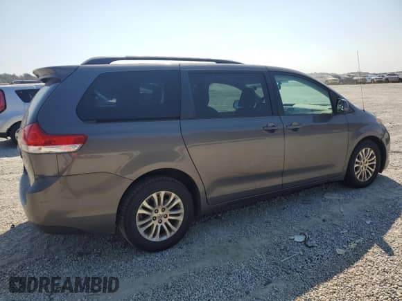 2012 Toyota Sienna XLE AAS with VIN 5TDYK3DC0CS212661, listed as a Copart auction lot 81634935 with 161,468 mi miles and Salvage title. Bid and sale history available at DreamBid. Image 3.