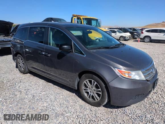 2013 Honda Odyssey EX-L with VIN 5FNRL5H61DB027011, listed as a Copart auction lot 69470375 with 123,161 mi miles and Salvage title. Bid and sale history available at DreamBid. Image 4.