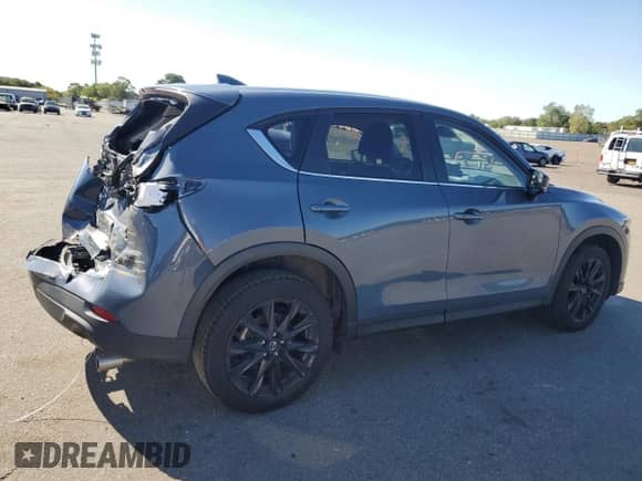 2023 Mazda CX-5 S Carbon Edition z VIN JM3KFBCM5P0219202, wystawiony jako Copart lot #81634365 z przebiegiem 24 429 mil mil oraz Szkoda całkowita • Salvage title. Historia ofert i sprzedaży dostępna na DreamBid. Obrazek 3.