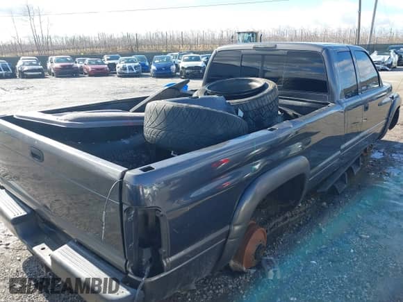 1999 Dodge 2500 with VIN 3B7KF2367XG174415, listed as a IAAI auction lot 41662623 with 260,853 mi miles and . Bid and sale history available at DreamBid. Image 4.