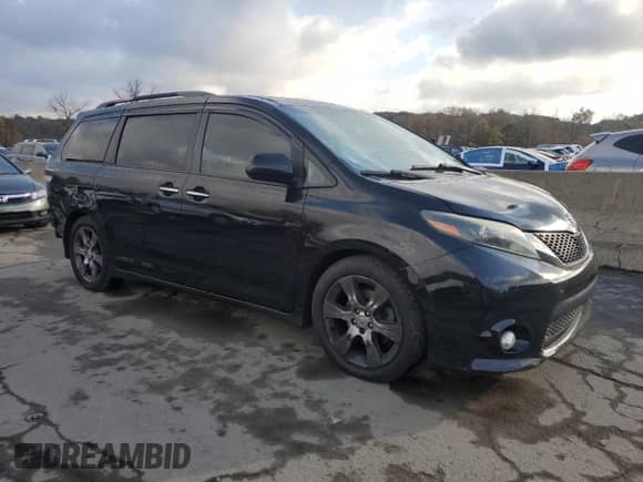 2015 Toyota Sienna SE with VIN 5TDXK3DC4FS557000, listed as a Copart auction lot 82646895 with 192,296 mi miles and Clean title. Bid and sale history available at DreamBid. Image 4.