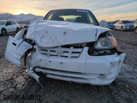 2004 Hyundai Accent GL z VIN KMHCG35C94U310459, wystawiony jako Copart lot #79477194 z przebiegiem 86 942 mil mil oraz Szkoda całkowita • Salvage title. Historia ofert i sprzedaży dostępna na DreamBid. Obrazek 5.