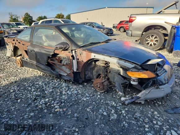 1994 Saturn SC with VIN 1G8ZG1575RZ133631, listed as a Copart auction lot 85352545 with 84,474 mi miles and Salvage title. Bid and sale history available at DreamBid. Image 4.
