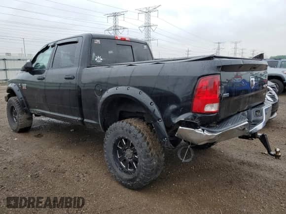 2012 Dodge RAM with VIN 3C63D3DL1CG341325, listed as a Copart auction lot 57330205 with 180,164 mi miles and Salvage title. Bid and sale history available at DreamBid. Image 2.