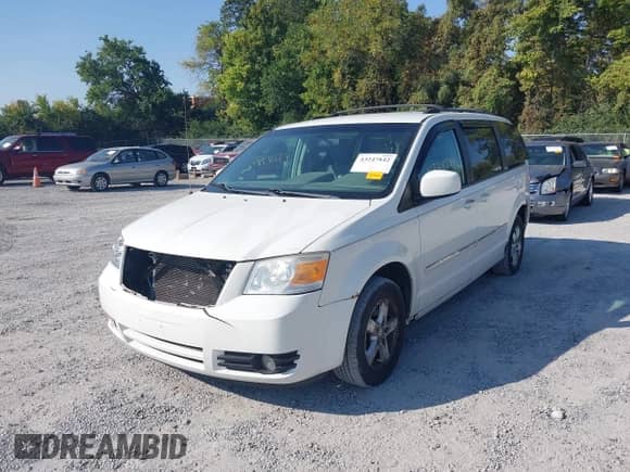 2009 Dodge Grand Caravan SXT with VIN 2D8HN54139R583365, listed as a IAAI auction lot 43247842 with 174,640 mi miles and . Bid and sale history available at DreamBid. Image 2.