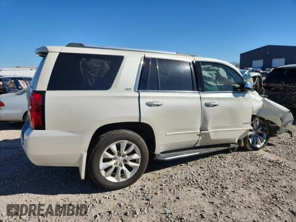 2015 Chevrolet Tahoe LTZ с VIN 1GNSKCKC0FR658120, выставлен на аукционе Copart как лот 81687465 с пробегом Не указан миль и Чистый • Clean title. История ставок и продаж доступна на DreamBid. Изображение 3.