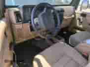 2002 Jeep Wrangler X z VIN 1J4FA39S22P776339, wystawiony jako Copart lot #57907165 z przebiegiem 154 088 mil mil oraz Szkoda całkowita • Salvage title. Historia ofert i sprzedaży dostępna na DreamBid. Obrazek 8.