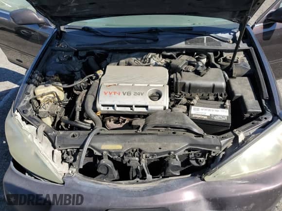 2003 Toyota Camry LE z VIN 4T1BF32K83U550112, wystawiony jako Copart lot #89713195 z przebiegiem 124 186 mil mil oraz Szkoda całkowita • Salvage title. Historia ofert i sprzedaży dostępna na DreamBid. Obrazek 11.