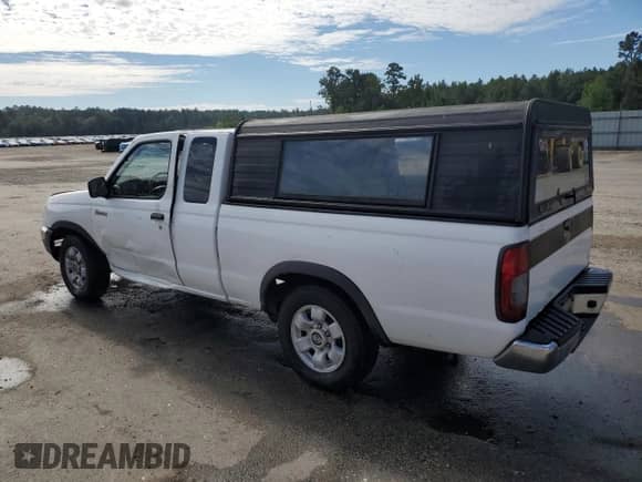 1998 Nissan Frontier XE with VIN 1N6DD26S5WC311065, listed as a Copart auction lot 84643135 with 212,985 mi miles and Salvage title. Bid and sale history available at DreamBid. Image 2.