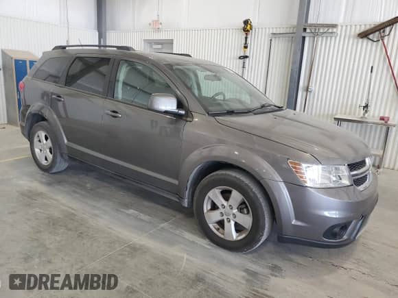 2012 Dodge Journey SXT with VIN 3C4PDCBG1CT265208, listed as a Copart auction lot 82449245 with 99,524 mi miles and Clean title. Bid and sale history available at DreamBid. Image 4.
