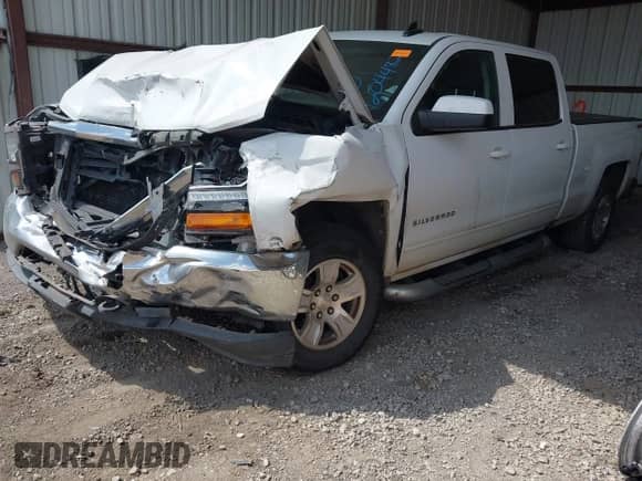 2018 Chevrolet Silverado 1500 LT with VIN 3GCUKREC3JG313849, listed as a IAAI auction lot 42044482 with 143,880 mi miles and . Bid and sale history available at DreamBid. Image 2.