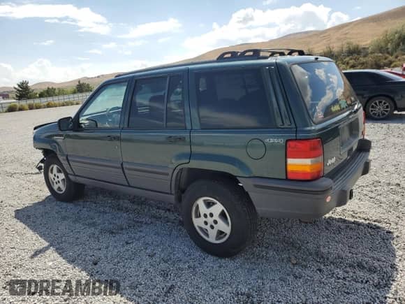 1995 Jeep Grand Cherokee Laredo with VIN 1J4GZ58Y1SC758744, listed as a Copart auction lot 80314815 with 142,149 mi miles and Salvage title. Bid and sale history available at DreamBid. Image 2.