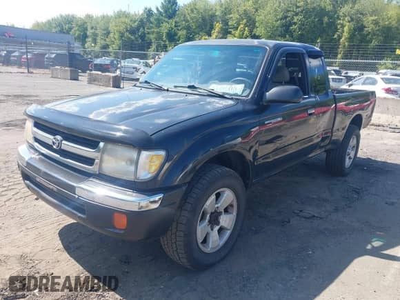 2000 Toyota Tacoma with VIN 4TAWM72N7YZ683933, listed as a IAAI auction lot 43154039 with 234,697 mi miles and . Bid and sale history available at DreamBid. Image 2.