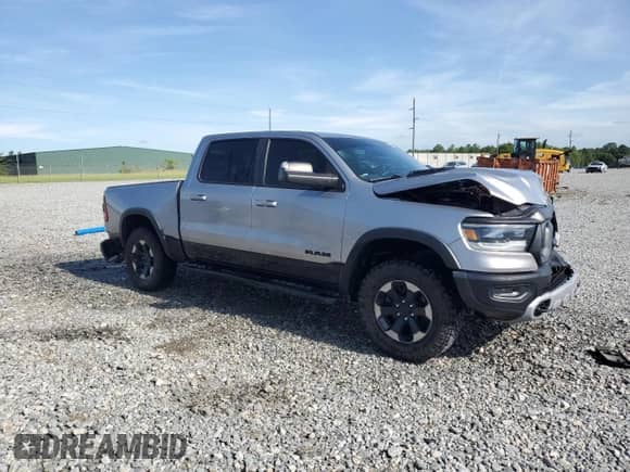 2020 Ram 1500 Rebel z VIN 1C6SRFLT7LN199084, wystawiony jako Copart lot #64990655 z przebiegiem 143 021 mil mil oraz Nie do naprawy • Non repairable. Historia ofert i sprzedaży dostępna na DreamBid. Obrazek 4.
