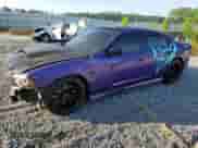 2013 Dodge Charger SRT-8 z VIN 2C3CDXEJ5DH740838, wystawiony jako Copart lot #57058225 z przebiegiem 127 808 mil mil oraz Szkoda całkowita • Salvage title. Historia ofert i sprzedaży dostępna na DreamBid. Obrazek 1.