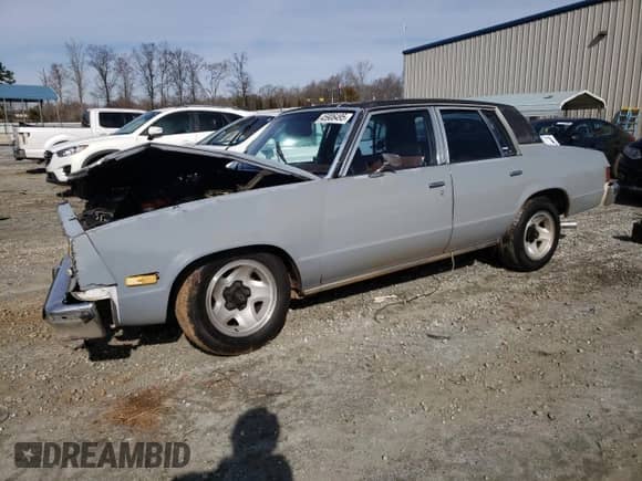 1982 Chevrolet Malibu Classic с VIN 1G1AW69J4CR214063, выставлен на аукционе Copart как лот 45906495 с пробегом Не указан миль и Списание • Salvage title. История ставок и продаж доступна на DreamBid. Изображение 1.