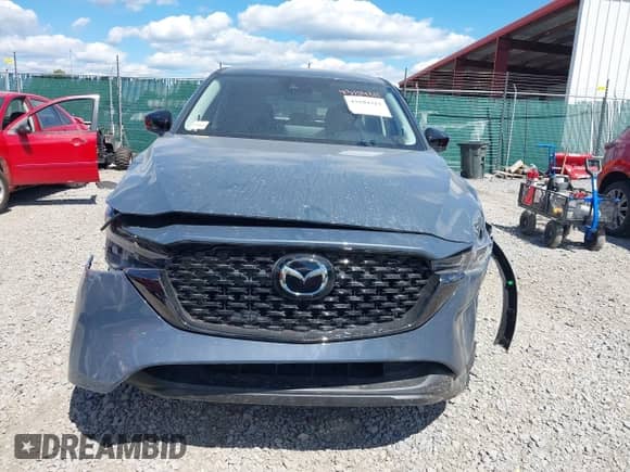 2025 Mazda CX-5 S Carbon Edition z VIN JM3KFBCM9S0704712, wystawiony jako IAAI lot #43104311 z przebiegiem 3 mil mil oraz . Historia ofert i sprzedaży dostępna na DreamBid. Obrazek 12.