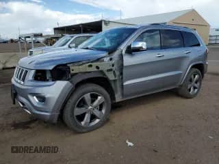 2015 Jeep Grand Cherokee Overland with VIN 1C4RJFCG5FC878174, listed as a Copart auction lot 81273805 with 72,402 mi miles and Salvage title. Bid and sale history available at DreamBid. Image 1.