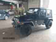 2005 Jeep Wrangler SE z VIN 1J4FA29195P358723, wystawiony jako IAAI lot #42158664 z przebiegiem 126 849 mil mil oraz . Historia ofert i sprzedaży dostępna na DreamBid. Obrazek 2.