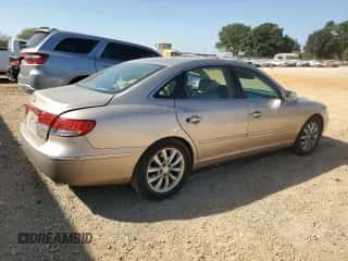 2007 Hyundai Azera SE z VIN KMHFC46F47A145627, wystawiony jako Copart lot #75274604 z przebiegiem 83 904 mil mil oraz Szkoda całkowita • Salvage title. Historia ofert i sprzedaży dostępna na DreamBid. Obrazek 3.