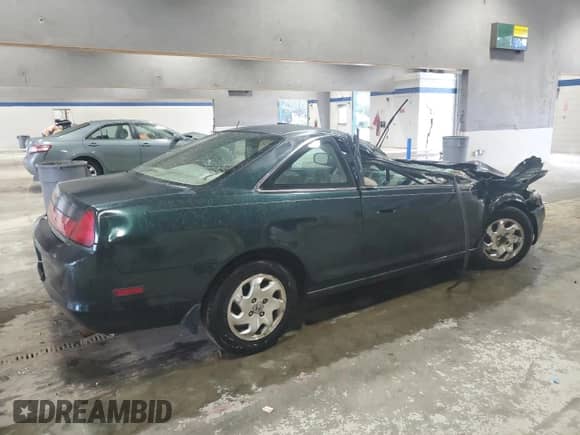 1999 Honda Accord EX with VIN 1HGCG3272XA026660, listed as a Copart auction lot 56629585 with 180,716 mi miles and Salvage title. Bid and sale history available at DreamBid. Image 3.